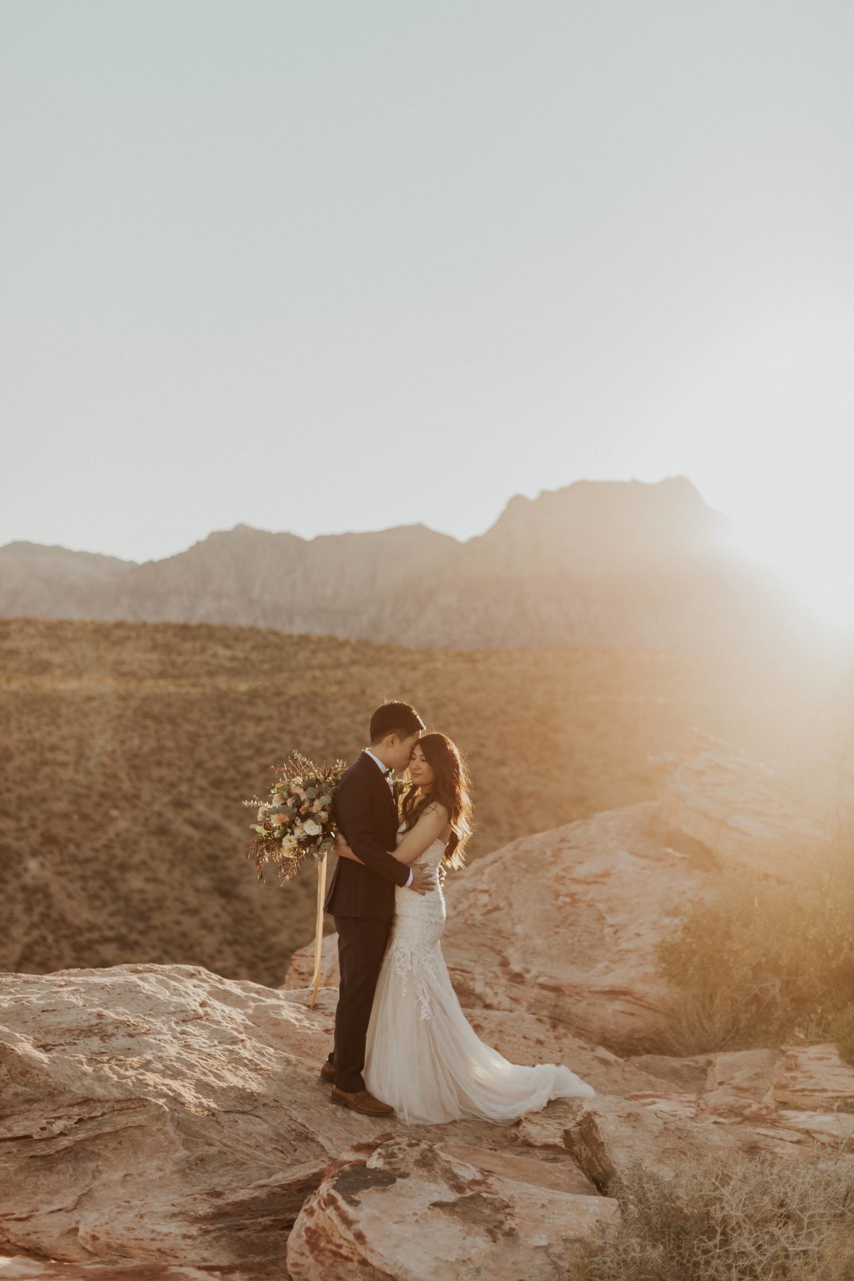 Bride and groom embrace at Red Rock, one of the best places to get married in Las Vegas with Emily Reno