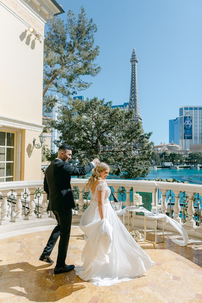  Eloping in Vegas: Ultimate Guide (2022). Bride and groom posing during their elopement shoot On The Strip.