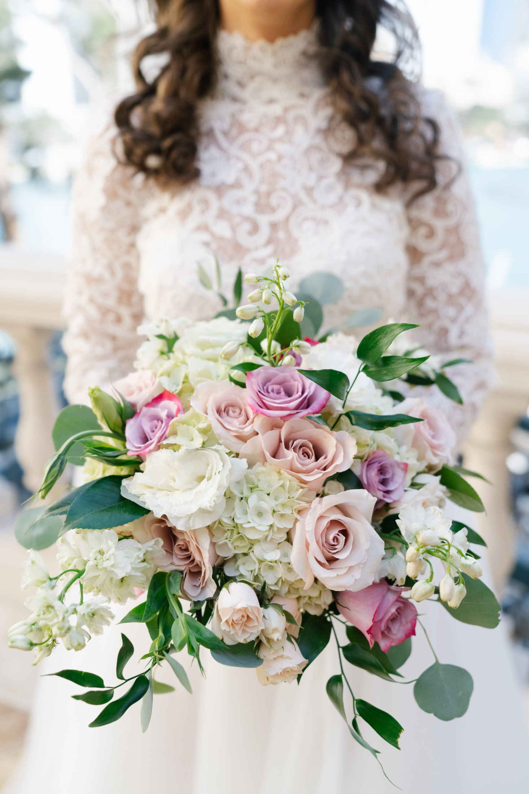 Close-up shot of bride holding her vibrant floral bouquet included in Elopement Las Vegas' wedding packages
