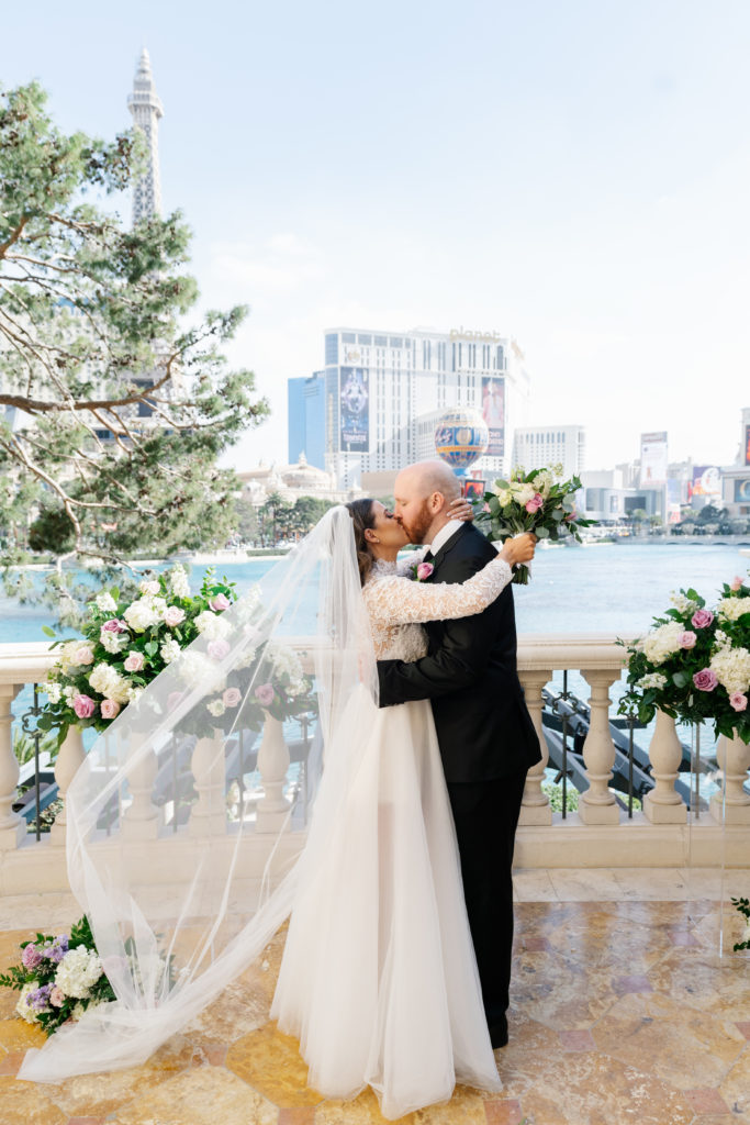 Couple sharing a kiss at their gorgeous wedding venue in Las Vegas