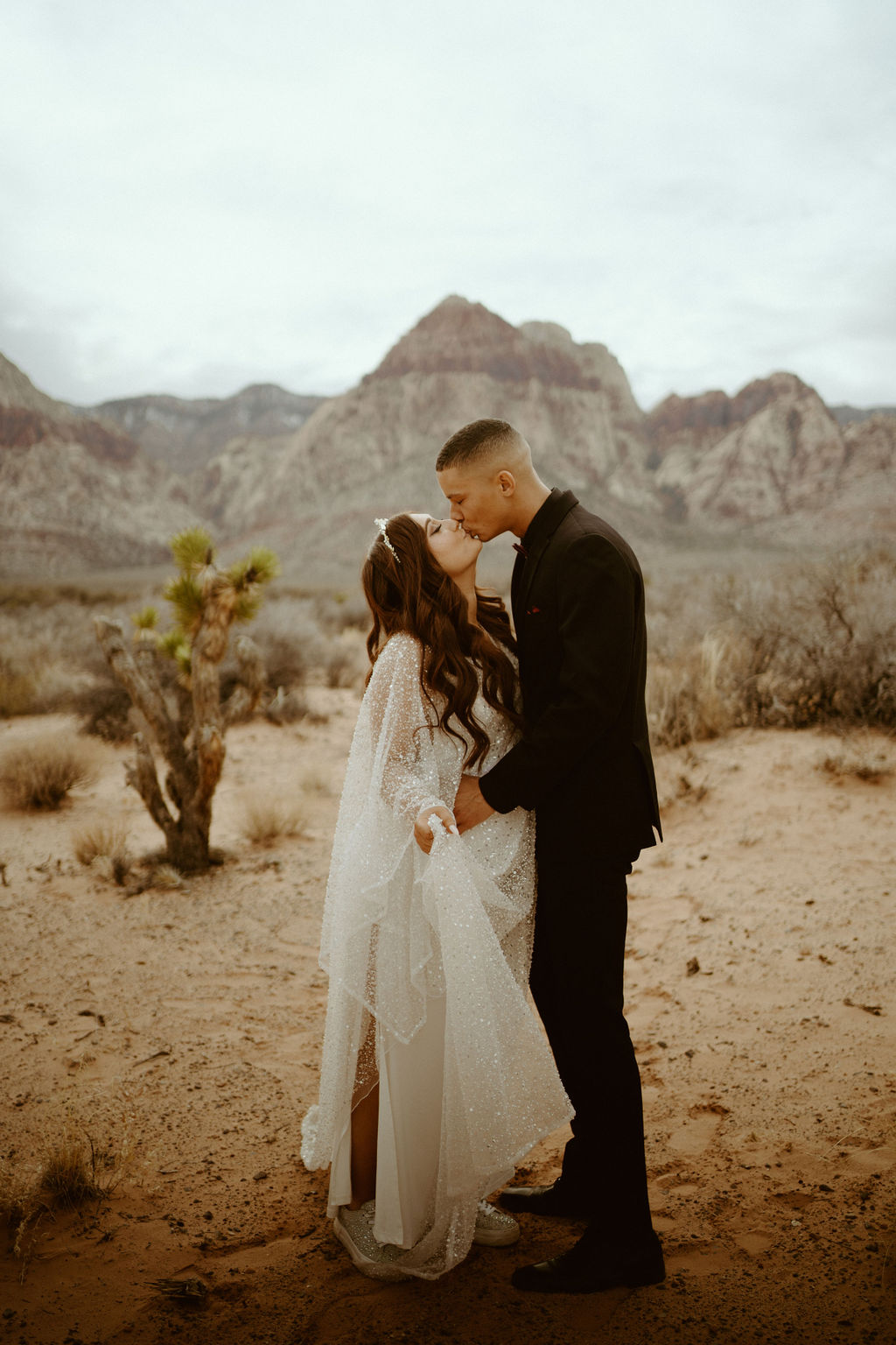Bride and groom sharing a kiss during their wedding shoot in Las Vegas
