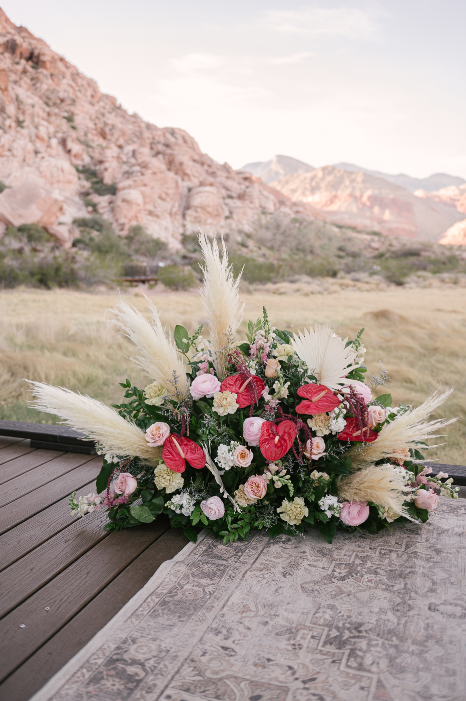 The Top All Inclusive Elopement Packages: Beautiful floral arrangement with view of mountain behind it.