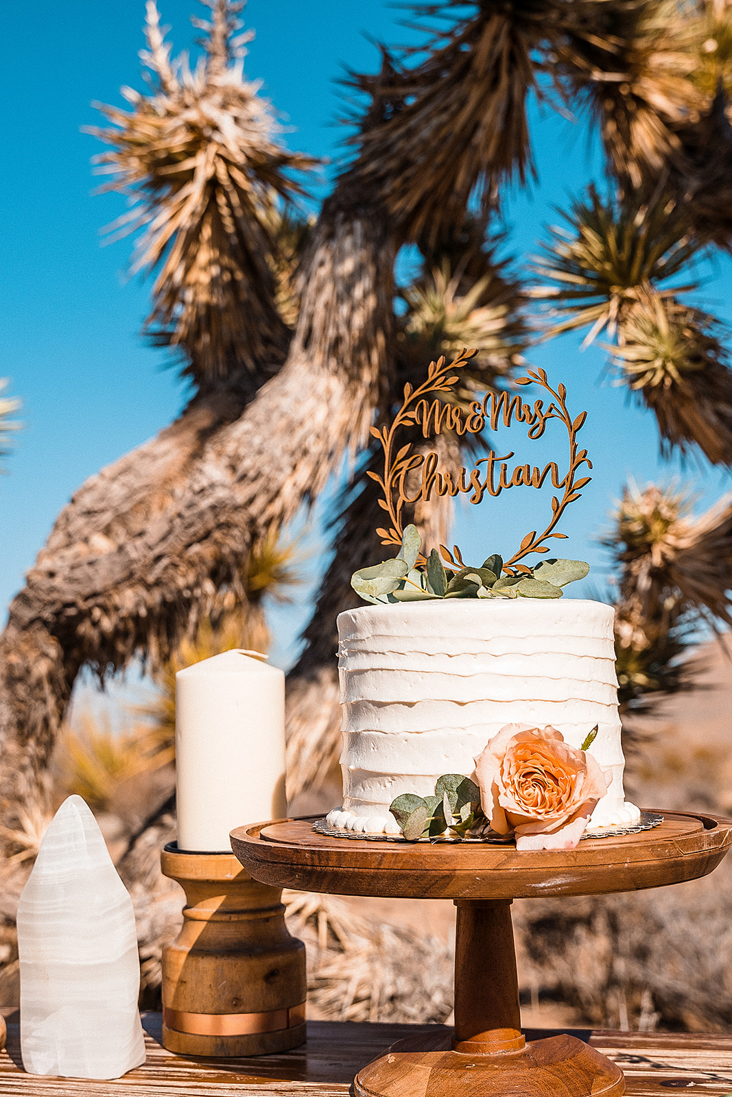 How Much Does It Cost To Get Married In Vegas. Simple wedding cake with cake topper placed on wooden tray.