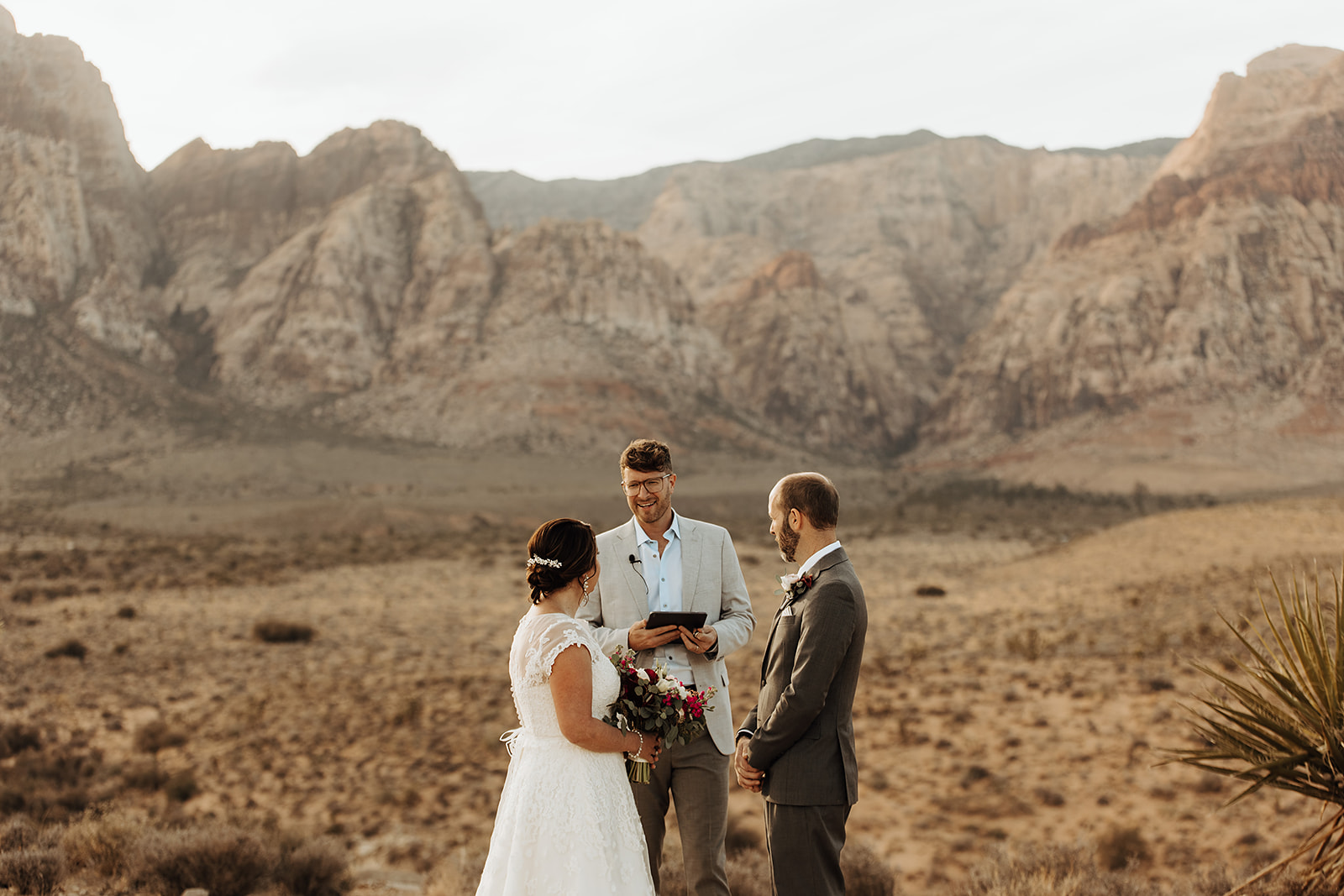 Bride and groom standing in front of the officiant during their Las Vegas elopement