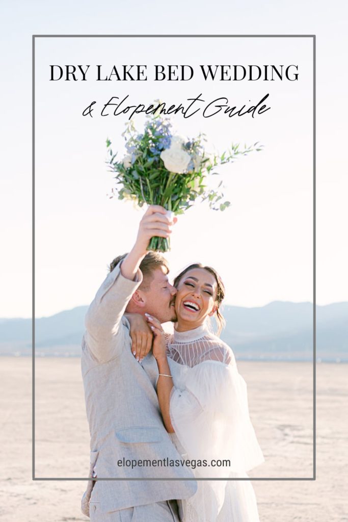 Groom planting a kiss on bride's cheek as they pose candidly; image overlaid with text that reads Dry Lake Bed Wedding and Elopement Guide