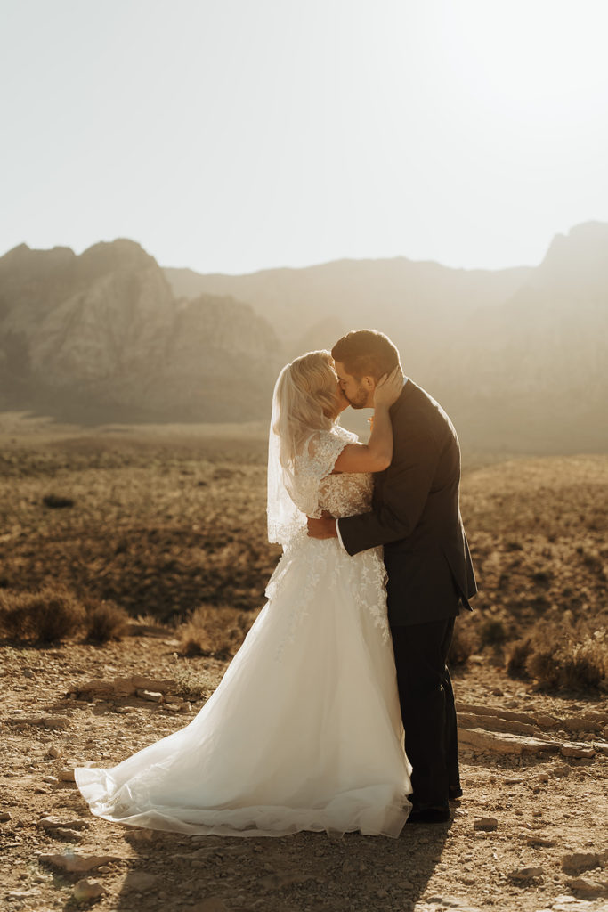 Bride and groom sharing a kiss during their Red Rock Canyon elopement shoot