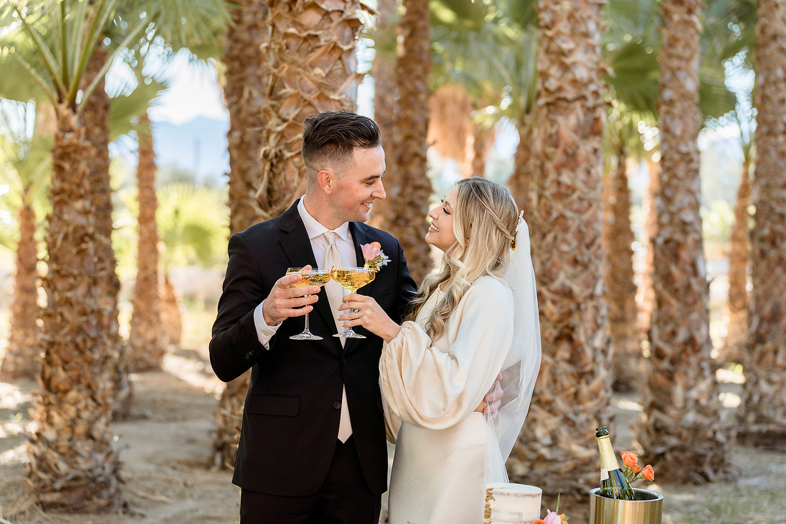 GreenGale Farms All-Inclusive Elopement Packages. Bride and groom smiling at each other while sharing a toast.
