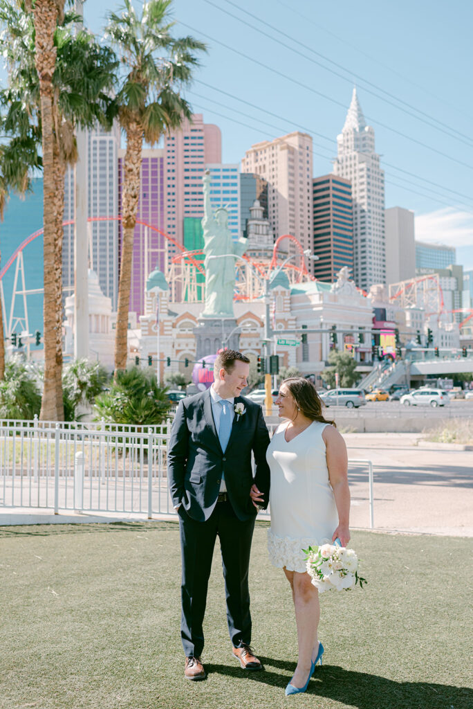 Bride and groom smiling at each other during their wedding shoot in Las Vegas Boulevard