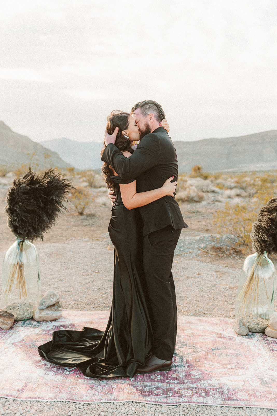 Bride and groom sharing a kiss during their black-themed elopement in Las Vegas
