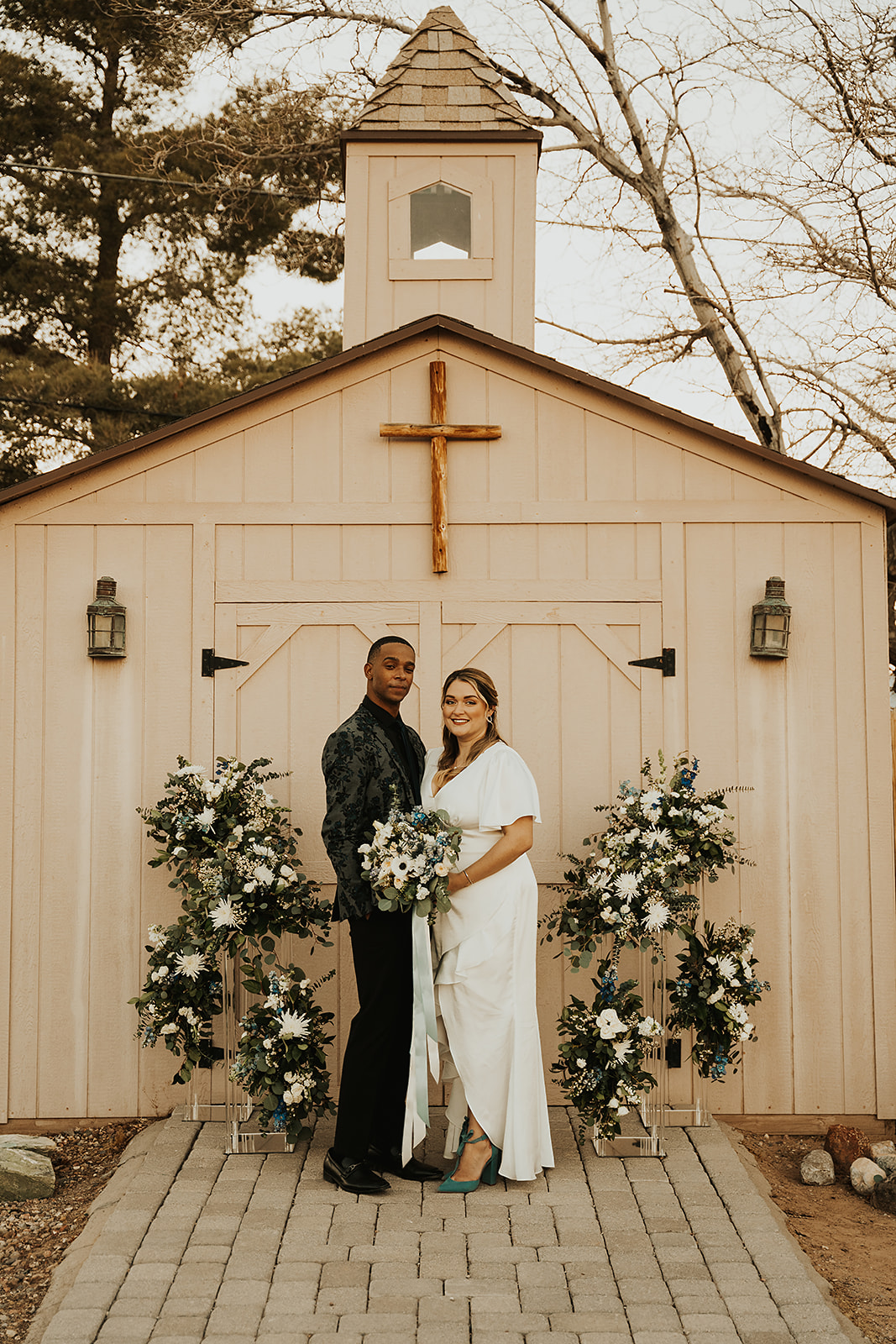 Couple posing in front of chapel during their elopement prepared by Elopement Las Vegas
