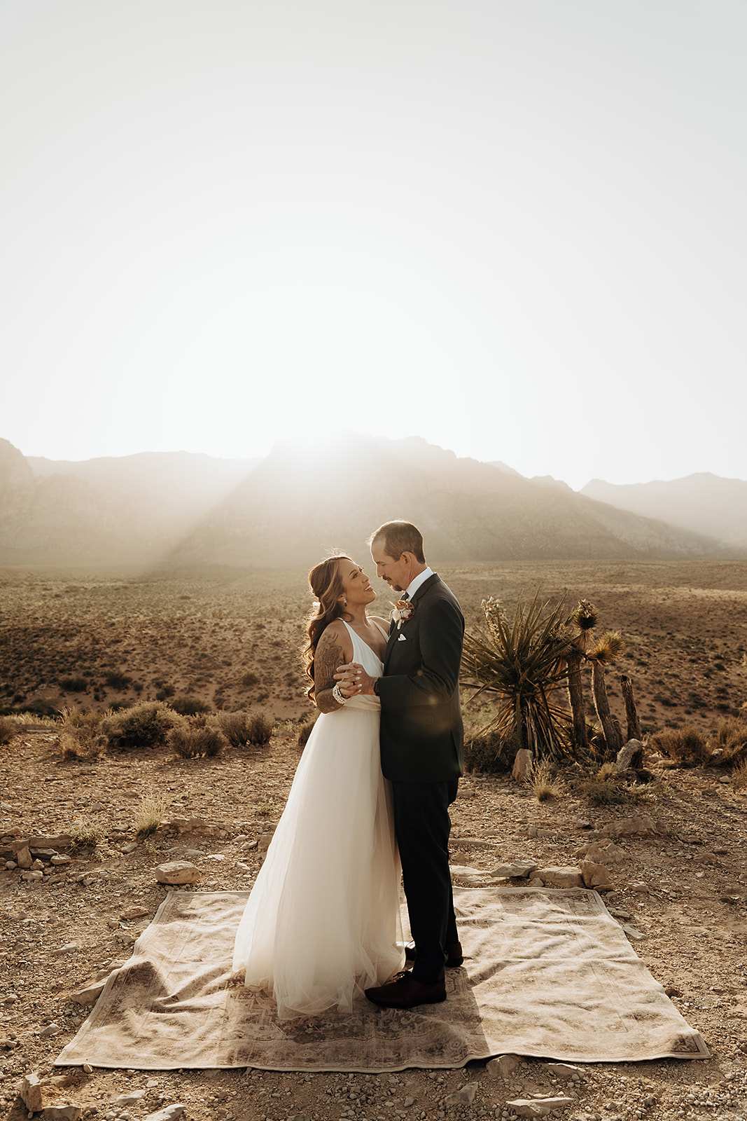 Bride and groom sharing an embrace during their Cactus Joe's elopement shoot