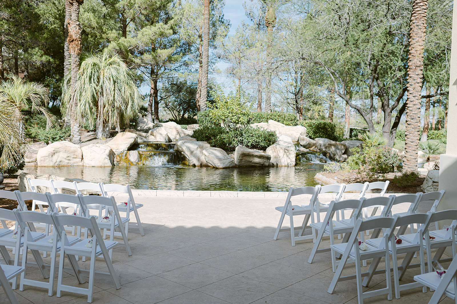 Overview of wedding ceremony venue in front of pond at JW Marriott Las Vegas