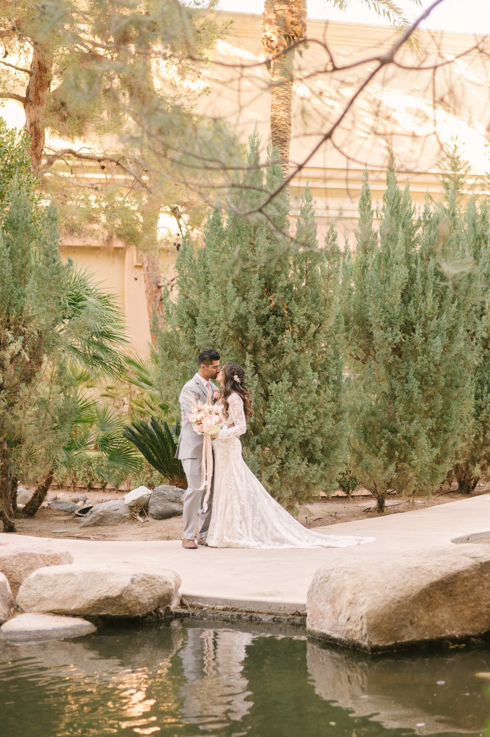 Bride and groom sharing a kiss during their wedding shoot arranged by Elopement Las Vegas