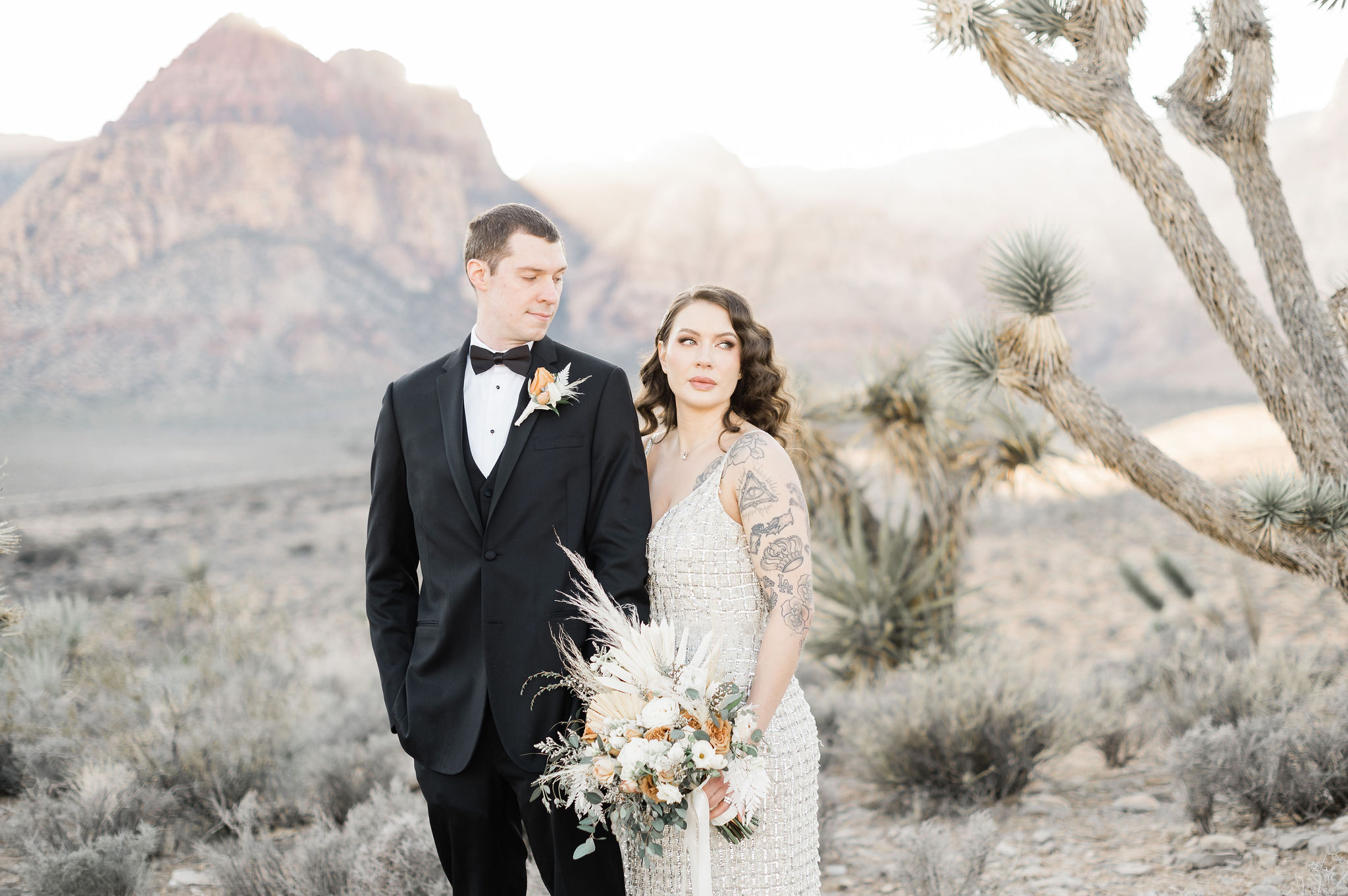 Bride and groom posing for their elopement shoot organized by Elopement Las Vegas