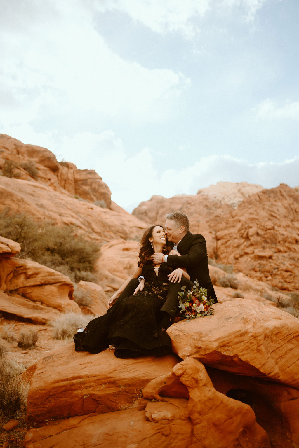 Elope In Vegas for Cheap: Is It Really Possible? Couple sharing an embrace during their elopement shoot.