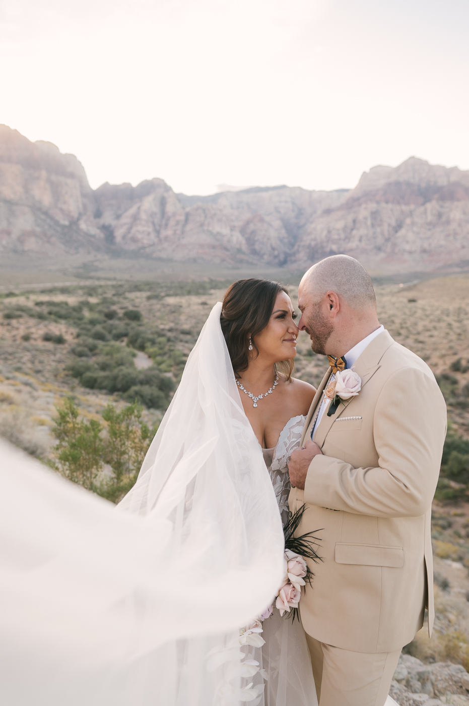 Elope In Vegas for Cheap: Is It Really Possible? Couple smiling at each other during their elopement shoot.